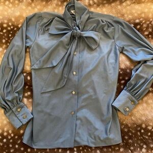 Avon blue blouse with tie bow and button cuffs